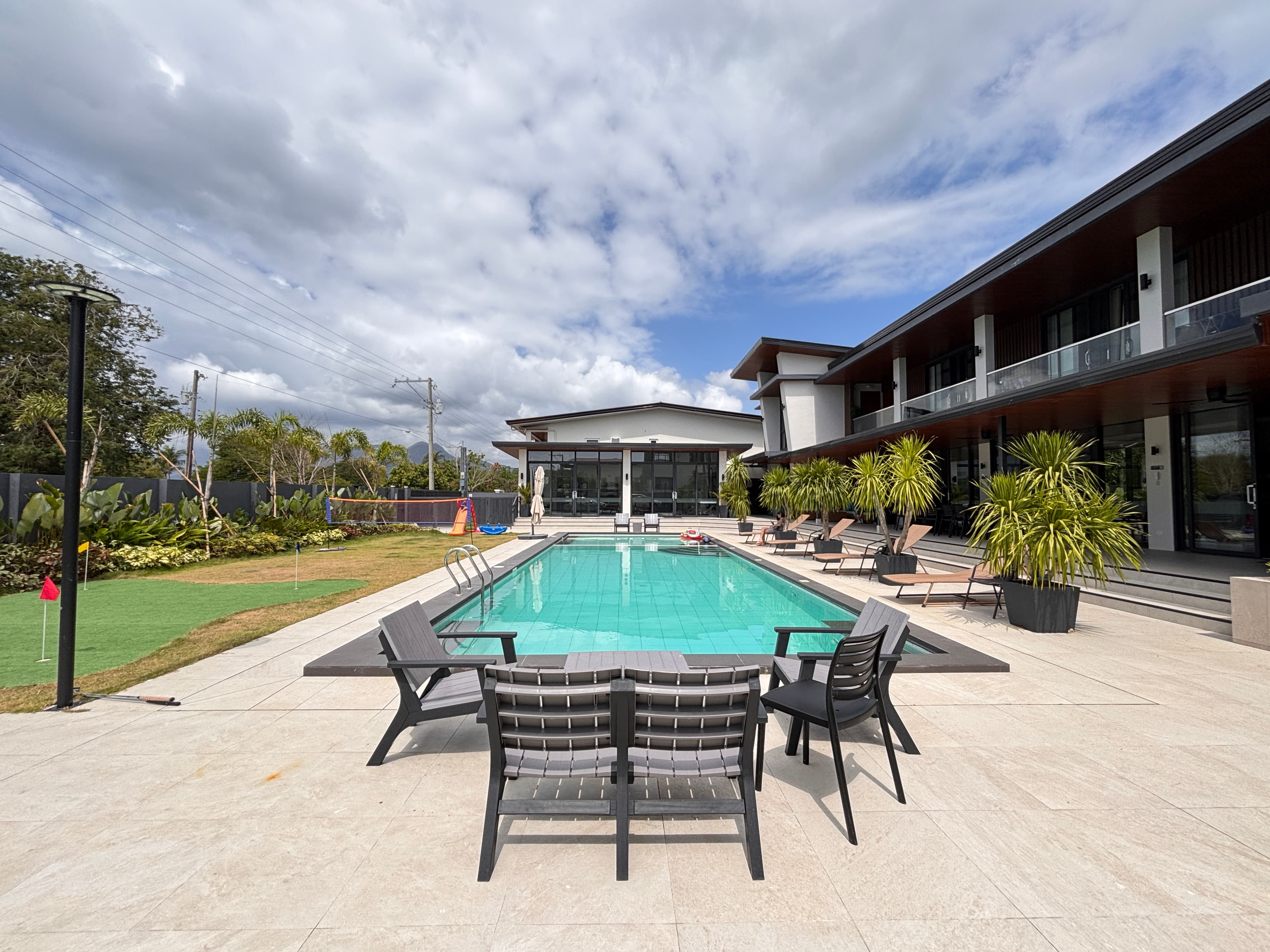 Longhouse Laiya pool and beachside atmosphere
